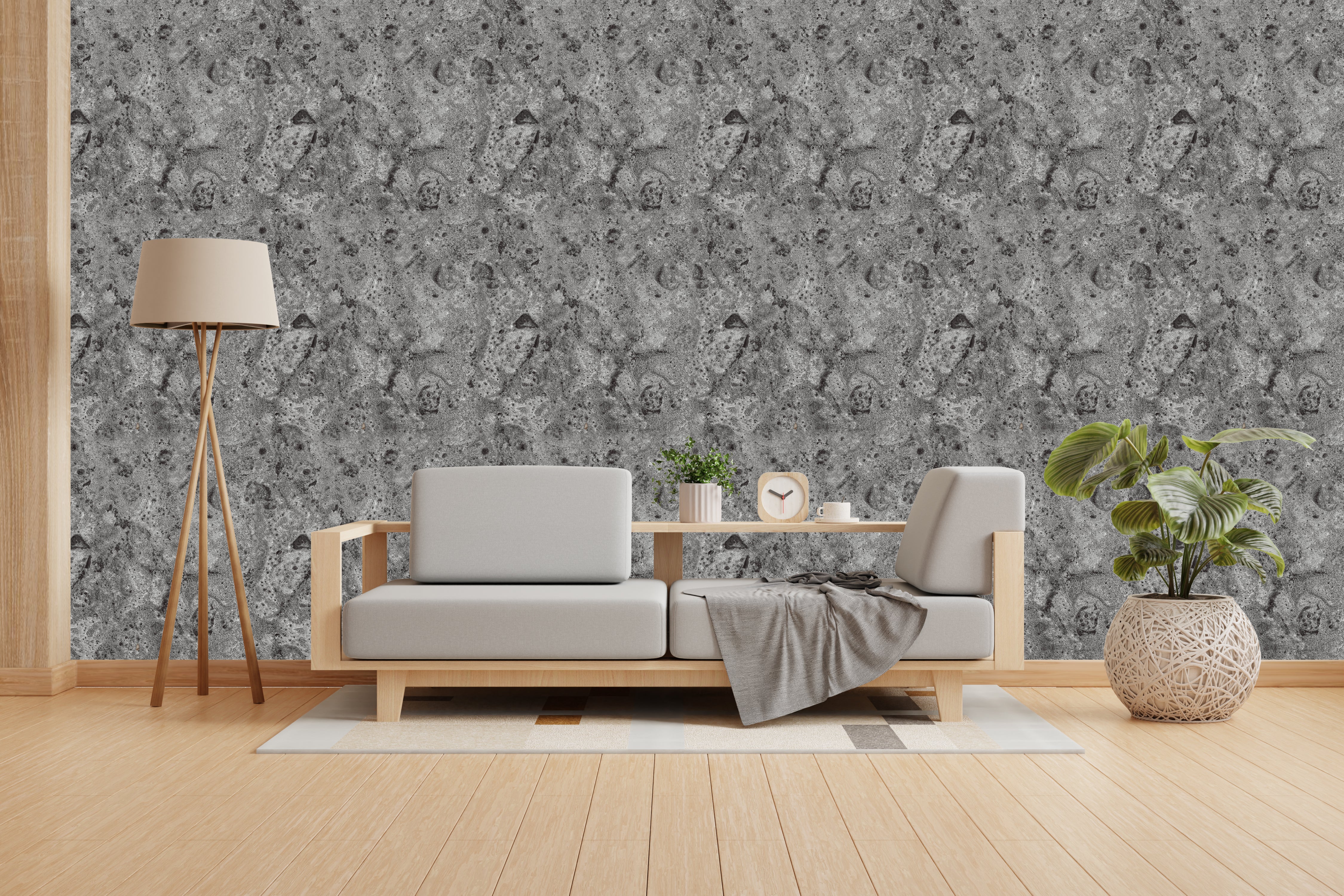Vishal Wallpapers - The Best Wallpaper Company In India, Modern living room with a gray sofa, wooden coffee table, and decorative elements against a textured wall.