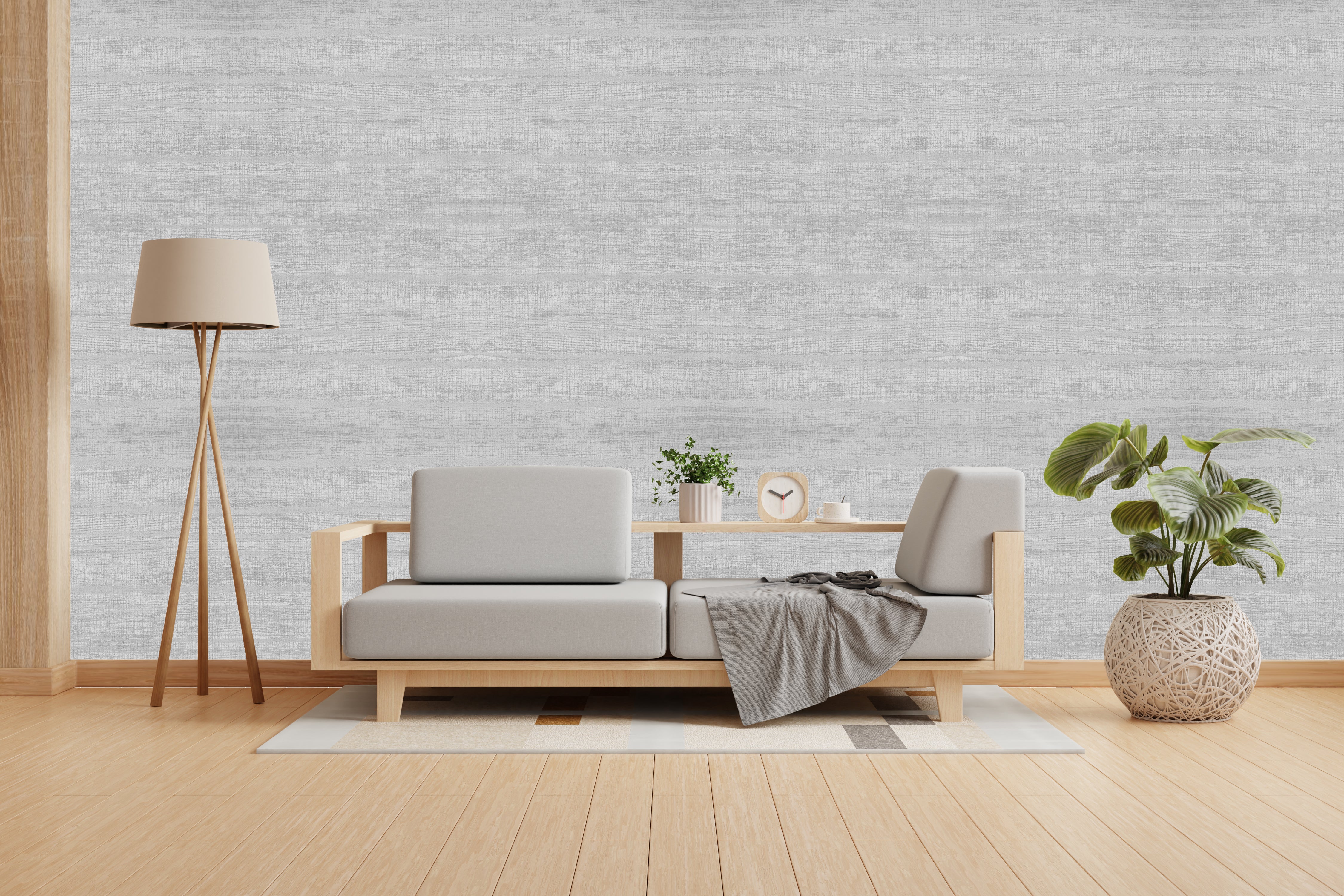 Vishal Wallpapers - The Best Wallpaper Company In India, Modern living room with a gray sofa, wooden coffee table, and decorative items against a light gray textured wall.