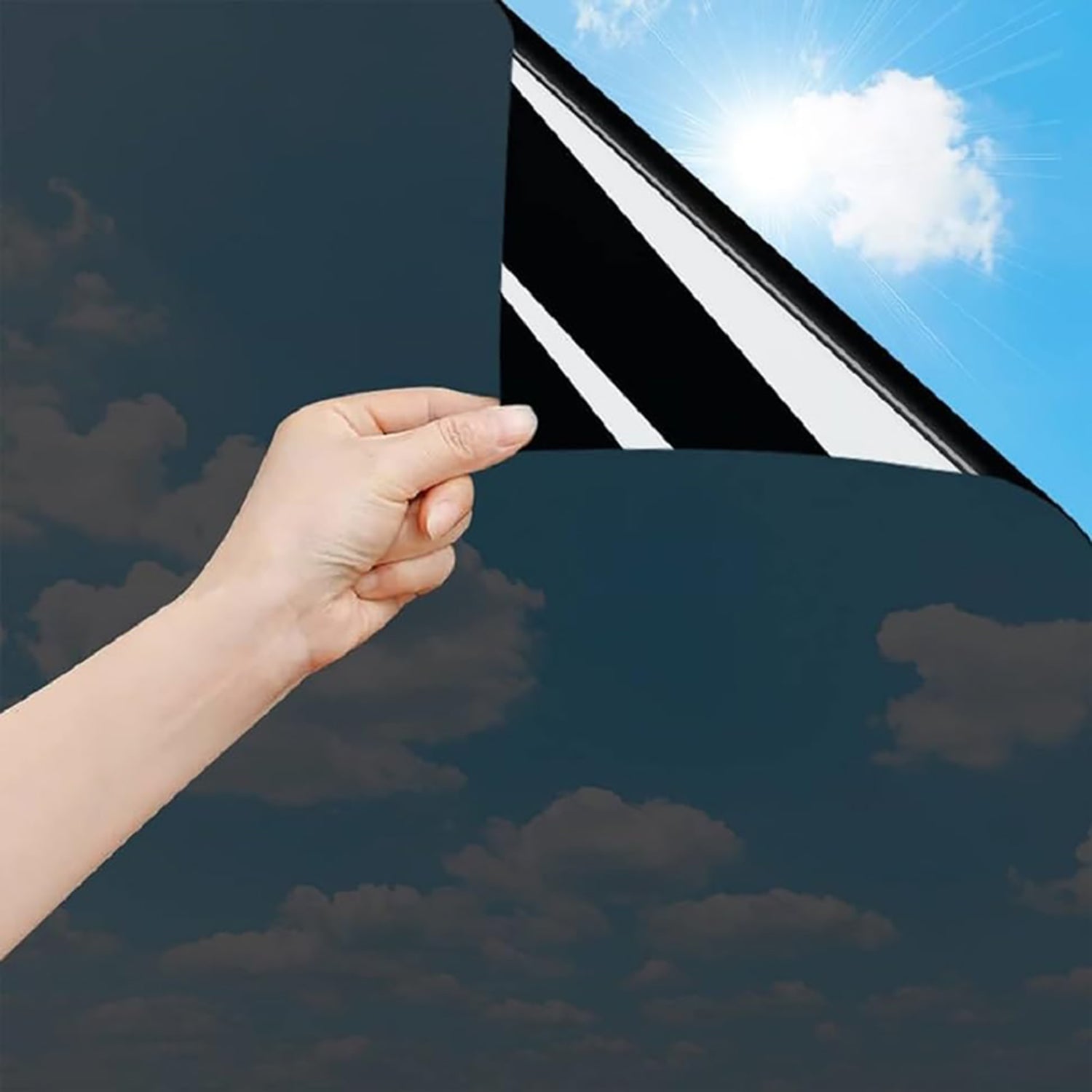 Hand Peeling Dark Window Film Revealing Blue Sky & Sun
