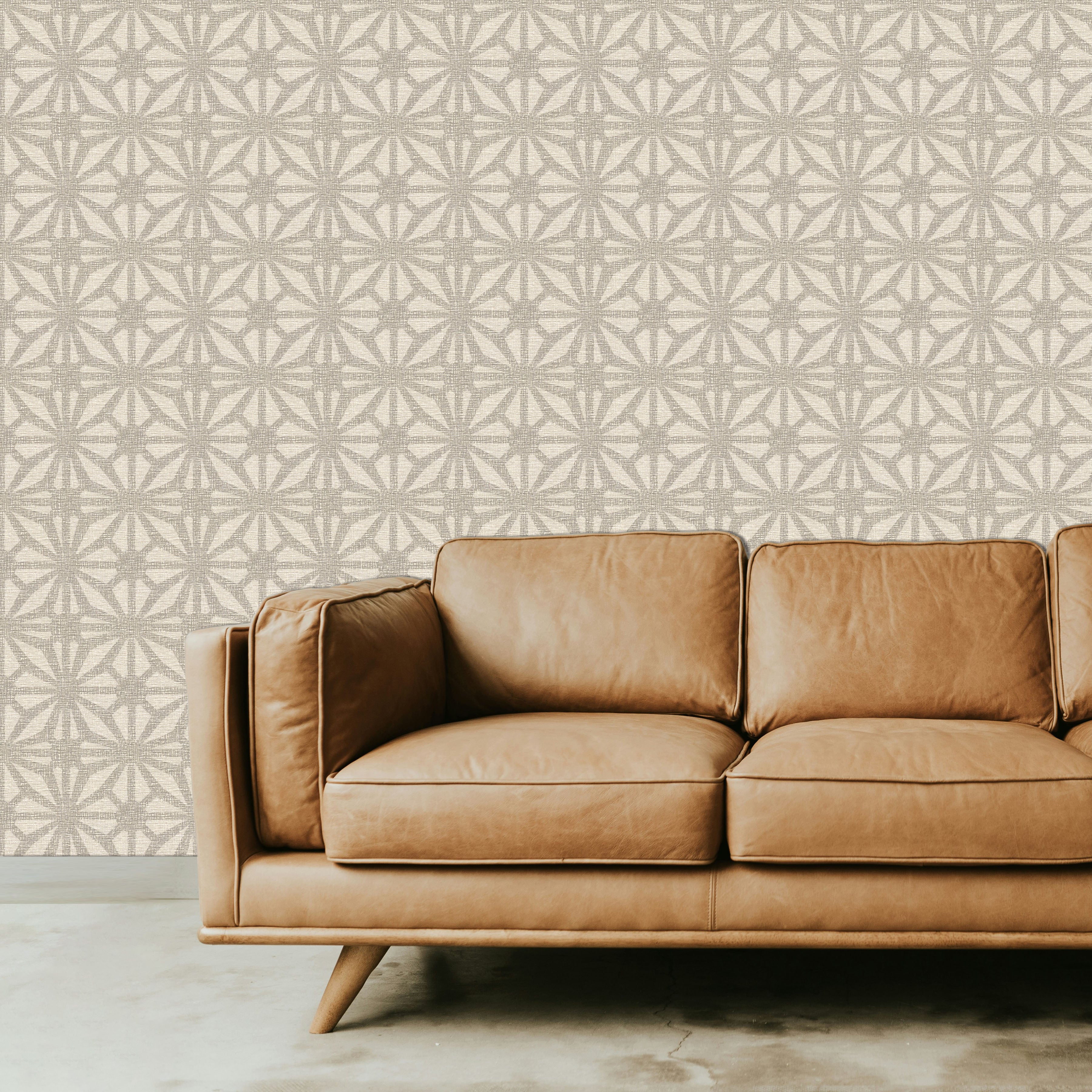 Neutral Geometric Patterned Wallpaper with Light Brown Leather Sofa